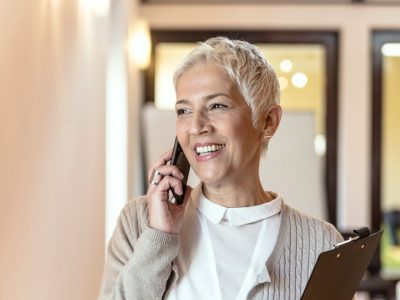 Lady on phone using Phone Etiquette